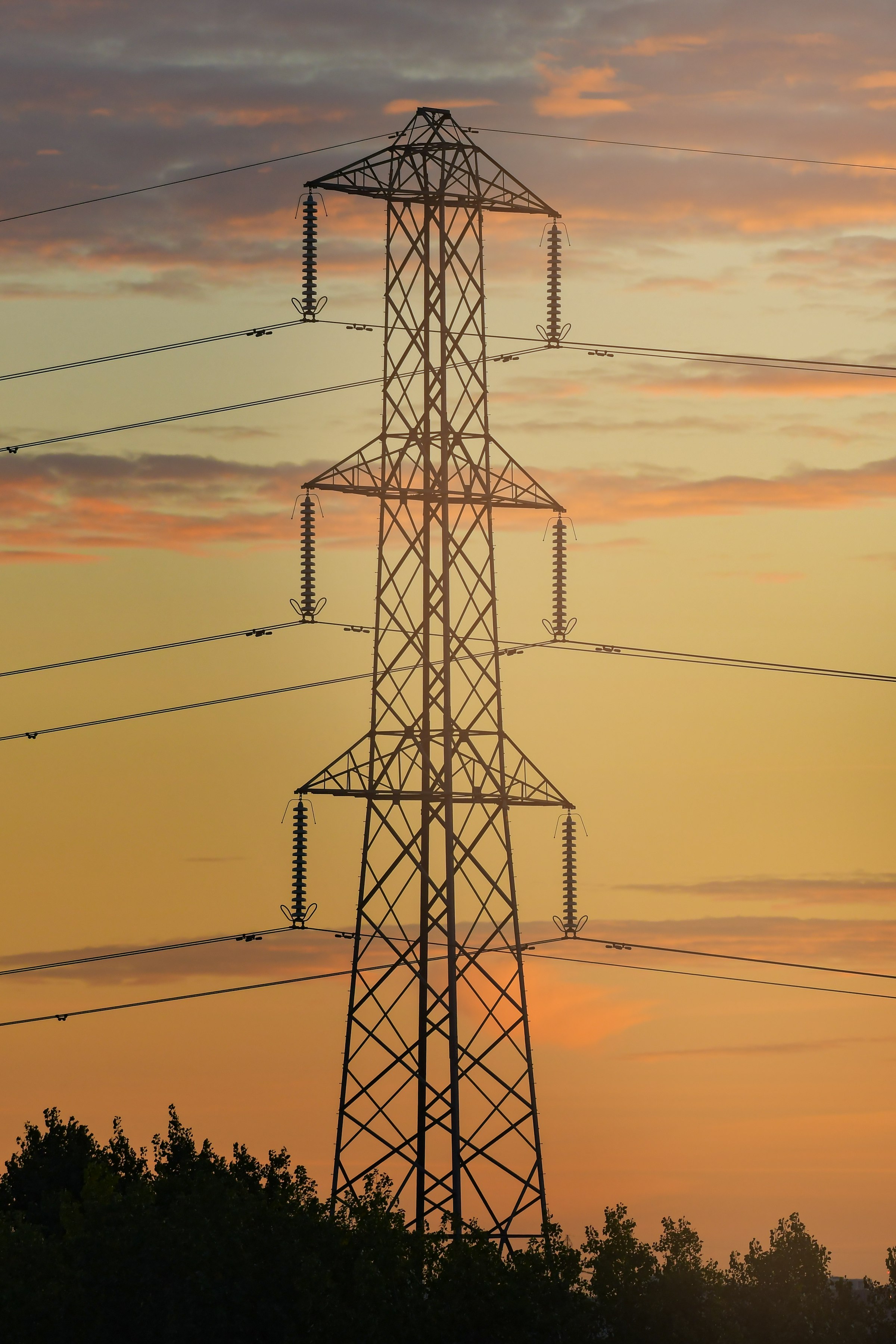 High-voltage transmission lines at dusk